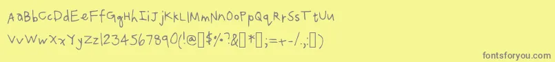 フォントCaro – 黄色の背景に灰色の文字