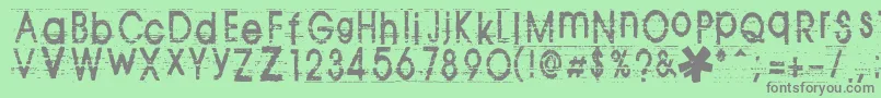 フォントTomva ffy – 緑の背景に灰色の文字