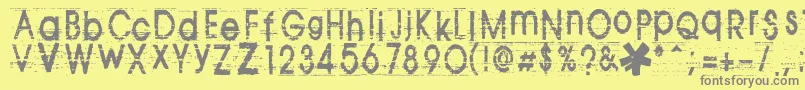 フォントTomva ffy – 黄色の背景に灰色の文字