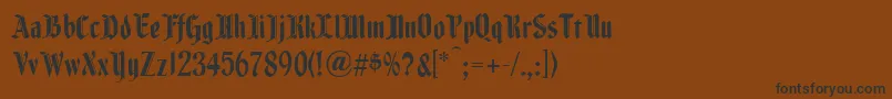 フォントFenwickwoodtype – 黒い文字が茶色の背景にあります