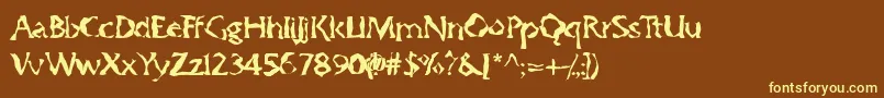 Gumbootcha-Schriftart – Gelbe Schriften auf braunem Hintergrund