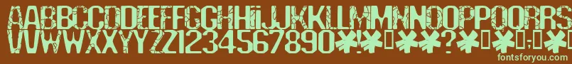 フォントDeadline – 緑色の文字が茶色の背景にあります。