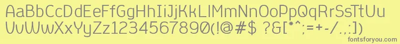 AleksandracRegular-fontti – harmaat kirjasimet keltaisella taustalla