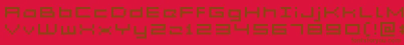 GrixelAcme5WideXtnd-Schriftart – Braune Schriften auf rotem Hintergrund