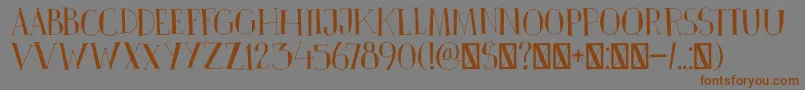 フォントDkPinkus – 茶色の文字が灰色の背景にあります。