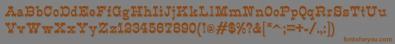 K22Eclair Font – Brown Fonts on Gray Background