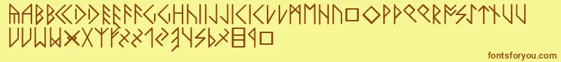 フォントLatinloversrunes – 茶色の文字が黄色の背景にあります。