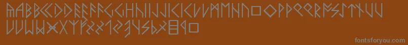 Czcionka Latinloversrunes – szare czcionki na brązowym tle