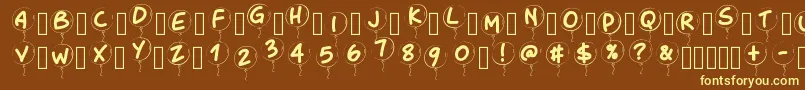 Pwballoon-fontti – keltaiset fontit ruskealla taustalla