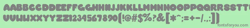 OvermuchRegular Font – Gray Fonts on Green Background