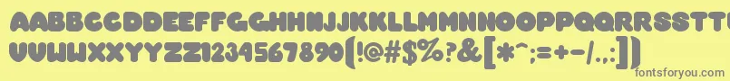 OvermuchRegular Font – Gray Fonts on Yellow Background