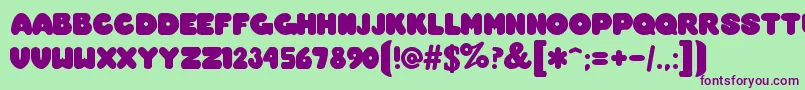 OvermuchRegular Font – Purple Fonts on Green Background