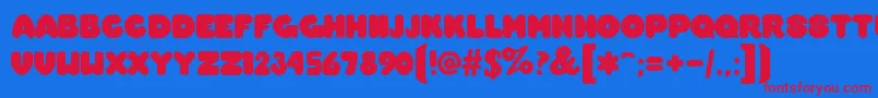 OvermuchRegular Font – Red Fonts on Blue Background