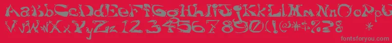 Fonte Aajaxsurrealfreak – fontes cinzas em um fundo vermelho