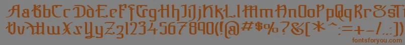 フォントTheBlackBlocReg – 茶色の文字が灰色の背景にあります。