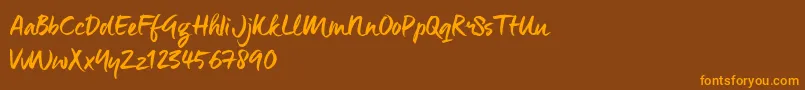 ManeoTrial Font – Orange Fonts on Brown Background