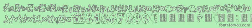 Meow-fontti – harmaat kirjasimet vihreällä taustalla