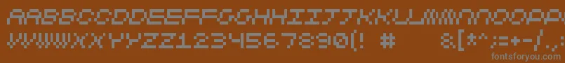 フォントCubicfive11 – 茶色の背景に灰色の文字