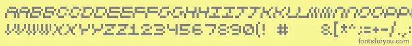 フォントCubicfive11 – 黄色の背景に灰色の文字
