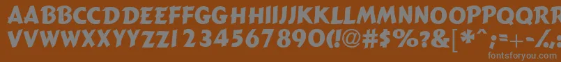 Gizmocapsssk-fontti – harmaat kirjasimet ruskealla taustalla