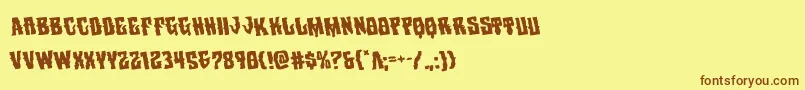 フォントWarlocksalerotate – 茶色の文字が黄色の背景にあります。