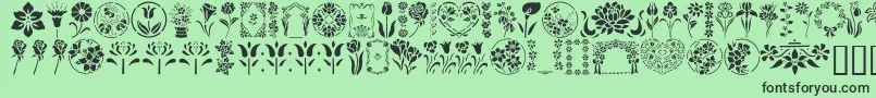 フォントGeFloralStencils – 緑の背景に黒い文字