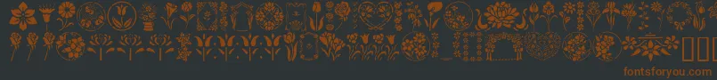 GeFloralStencils-Schriftart – Braune Schriften auf schwarzem Hintergrund