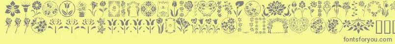 フォントGeFloralStencils – 黄色の背景に灰色の文字