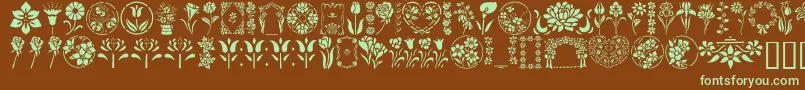 フォントGeFloralStencils – 緑色の文字が茶色の背景にあります。