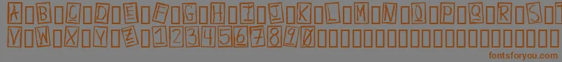 フォントHumanBrownEye – 茶色の文字が灰色の背景にあります。
