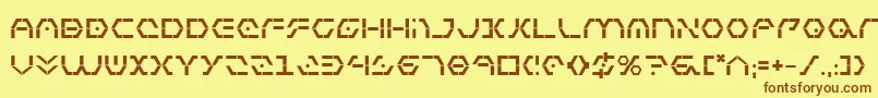 フォントZetasentryb – 茶色の文字が黄色の背景にあります。