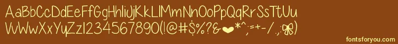 Czcionka DiamondGirlSkinny – żółte czcionki na brązowym tle