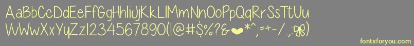 DiamondGirlSkinny Font – Yellow Fonts on Gray Background