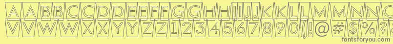 AFuturaortottlcmswotl-fontti – harmaat kirjasimet keltaisella taustalla