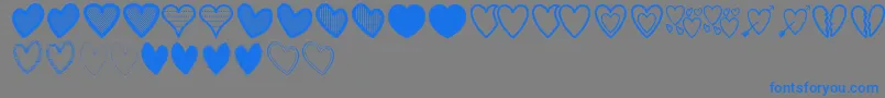 HeartsSt-Schriftart – Blaue Schriften auf grauem Hintergrund