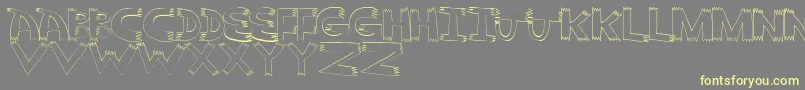 Pointy-Schriftart – Gelbe Schriften auf grauem Hintergrund