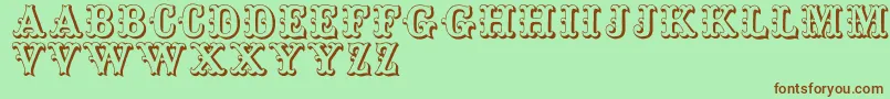 Toskanischeegyptienneinitialen Font – Brown Fonts on Green Background