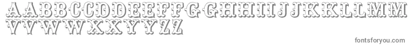 フォントToskanischeegyptienneinitialen – 白い背景に灰色の文字