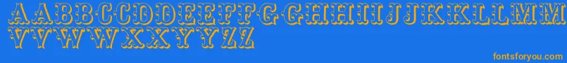 フォントToskanischeegyptienneinitialen – オレンジ色の文字が青い背景にあります。