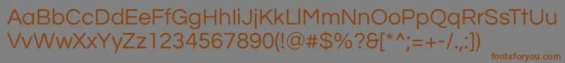 QuestrialRegular-Schriftart – Braune Schriften auf grauem Hintergrund