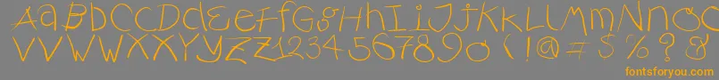 フォントRusticalligraphia – オレンジの文字は灰色の背景にあります。