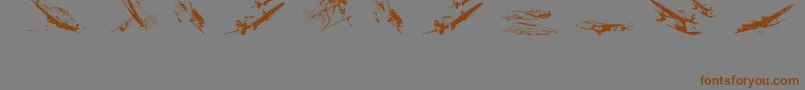 フォントWariiwarplanes – 茶色の文字が灰色の背景にあります。