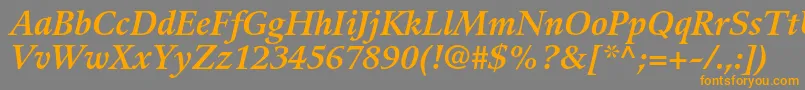 GuardiltstdBolditalic-Schriftart – Orangefarbene Schriften auf grauem Hintergrund