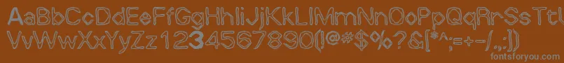 Whalw-fontti – harmaat kirjasimet ruskealla taustalla