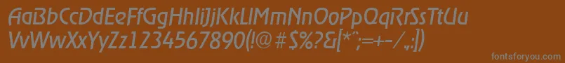 OnstageserialItalic-fontti – harmaat kirjasimet ruskealla taustalla