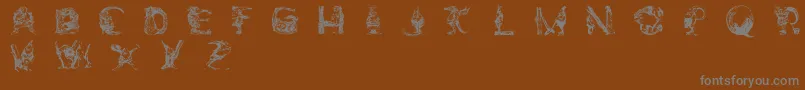 ElfabetDecorative-Schriftart – Graue Schriften auf braunem Hintergrund