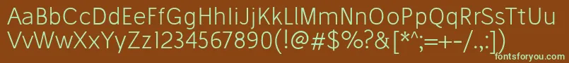 フォントStiluLight – 緑色の文字が茶色の背景にあります。