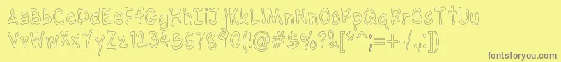 Шрифт NipcensHandwritingCondout – серые шрифты на жёлтом фоне