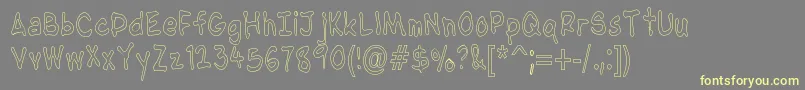 NipcensHandwritingCondout Font – Yellow Fonts on Gray Background
