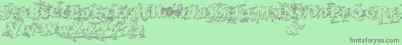 Darkwoodbeveled Font – Gray Fonts on Green Background